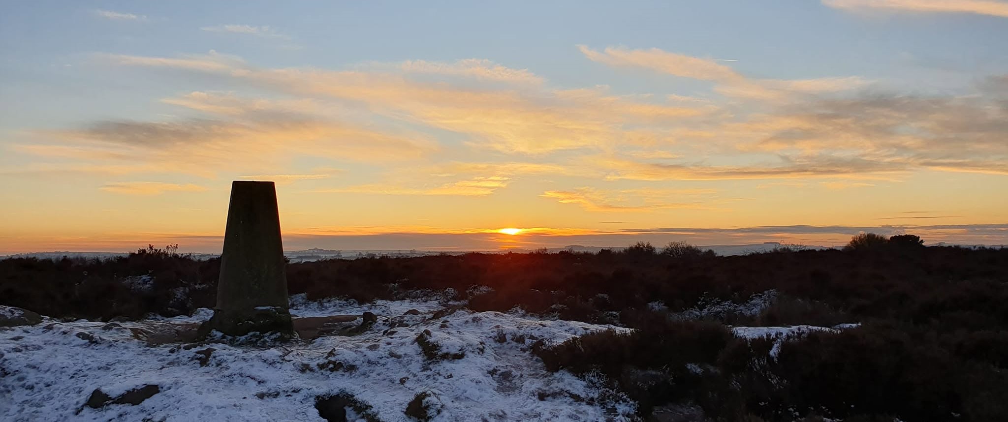 Stanton Moor trig point in the Derbyshire countryside